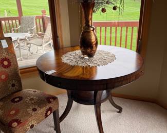 Round Mahogany Dining Table with Pedestal Base and Brass Casters
