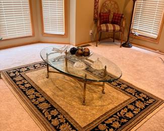 Oval Glass Top Coffee Table with Brass Base and Oriental Style Rug
