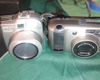 Two brand new Samsung tablets, 35 mm cameras, binoculars