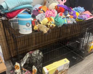 Huge dog crates and plenty of dog toys