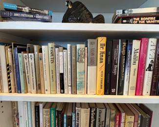 Collection of Hardcover and Paperback Books with Figurine