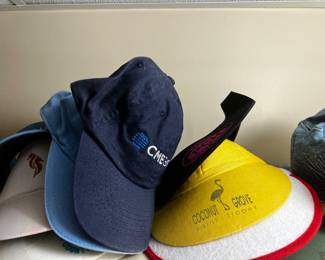 Collection of Assorted Baseball Caps and Sun Visors