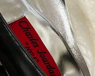 $225, Charles Jourdan black leather pointed toe pumps with silver lining and box.