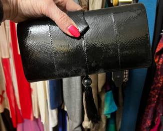 $125, Rafael Sanchez black patent leather evening bag with braided strap and tassel detail.