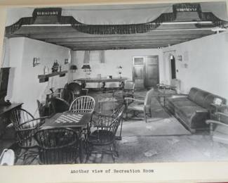 This photo from 1920 shows the antique dining table, pictured in the far back of the room.