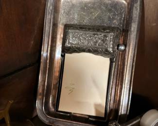 Silverplate serving tray and ornate vanity mirror