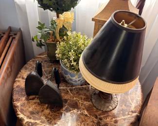 Round marble top side table with tole shade lamp and topiary