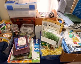 Boxes of linens, kitchen towels and household goods