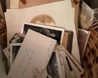 Basket of antique photographs, postcards and paper ephemera