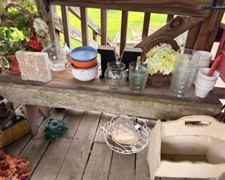 Assorted glassware, enamelware bowls, baskets and garden accents
