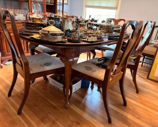 Antique mahogany dining table with needlepoint seat Queen Anne chairs