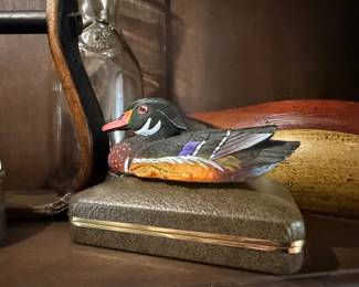 Painted carved wood duck decoy and antique glass bottle