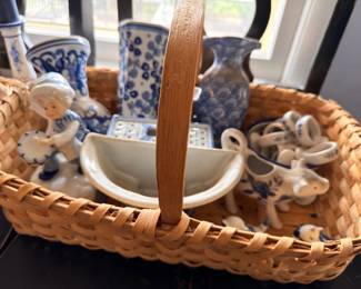 Basket of blue and white porcelain accessories and shakers