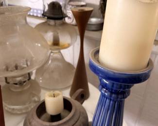 Assorted candle holders, pillar candlesticks and glass oil lamp