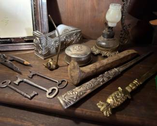 Antique skeleton keys, ornate letter opener and desk accessories