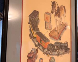 Framed signed print of antique toys, rocking horse and cast iron train