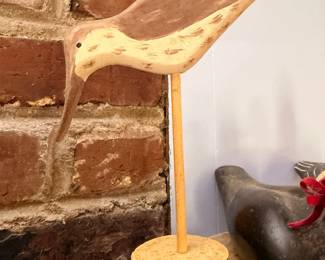 Carved wood folk art shorebird decoy on stand