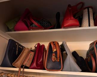 Assorted leather handbags and purses, shelf display