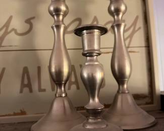 Graduated set of pewter candlesticks