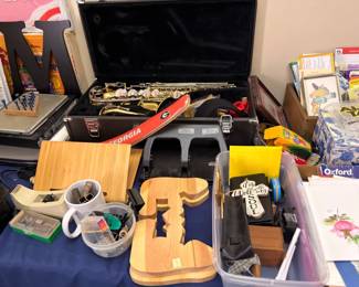 Saxophone in case, Georgia cutting boards and assorted goods