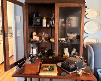 Drop leaf table and curio cabinet with collectibles