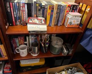 Bookshelf with books, DVDs, pewter mugs and assorted items
