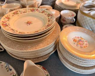 Floral china dinner plates with gold gilt borders