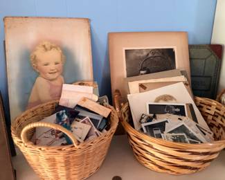 Baskets of antique photographs, vintage prints and paper ephemera