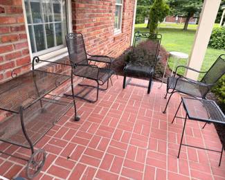 Black wrought iron patio furniture set, glider and chairs