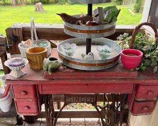 Antique treadle sewing machine base table with wood tiered serving stand