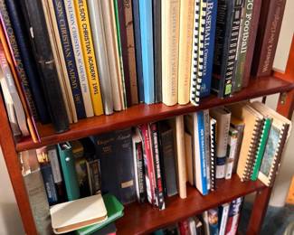 Bookshelf of books, yearbooks and sports references