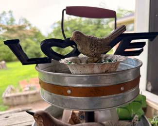 Metal LOVE sign and cast bird figurine with galvanized tub
