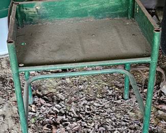table to four metal chairs