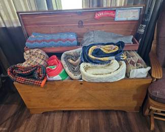 Blanket chest with  quilts and blankets 