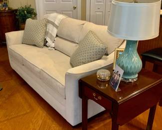 Sofa, end table, lamp 