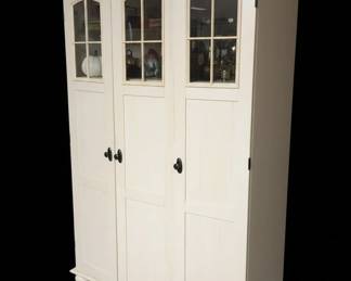 Cream Colored ThreeDoor Cabinet with Glass Panes and PullOut Shelf