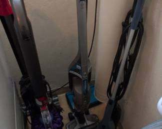 Assorted Vacuums Dyson Upright, Black Decker Cordless Stick, and Bissell Corded Stick