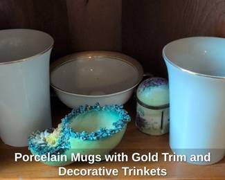 Porcelain Mugs with Gold Trim and Decorative Trinkets