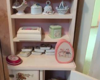Vintage Bunny Figurines and Decorative Boxes on Pastel Pink Shelf Unit