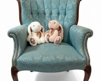 Collection of Plush Bunnies on a Vintage Teal Armchair