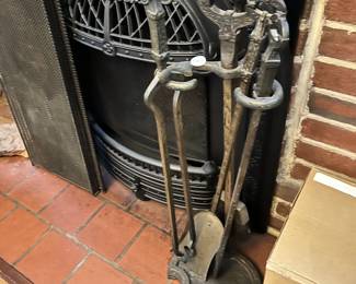 Iron andirons, and metal mesh acreen.