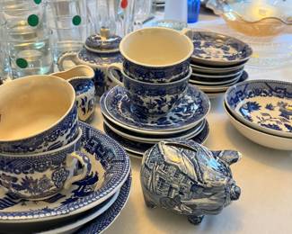 Staffordshire piggy bank, blue willow servicing bowls, tea cups and saucers