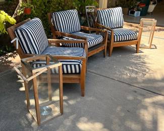3 heavy teak frontline chairs and striped cushions