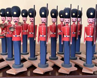 Carved soldiers on extendable frame