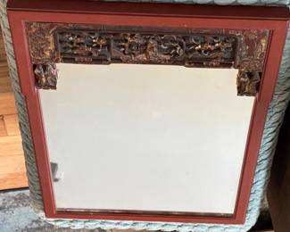 an Antique Red Lacquered Mirror with Intricate HandCarved Wooden Frame