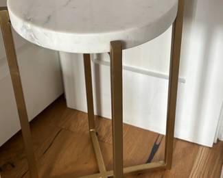Round marble and gold-toned accent table