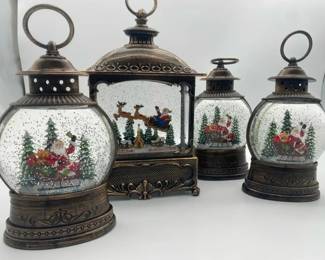 4 Lighted Snowing Santas plastic