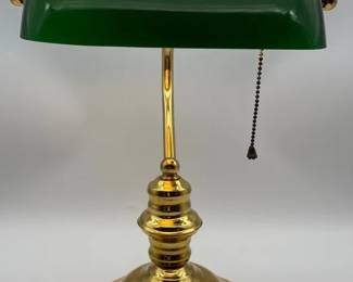 A vintage brass and green glass bankers desk lamp.