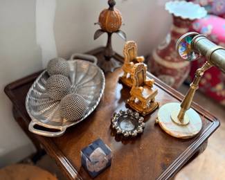 Brass telescope and decor on side table