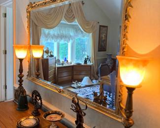 Large gilt-frame mirror over sideboard